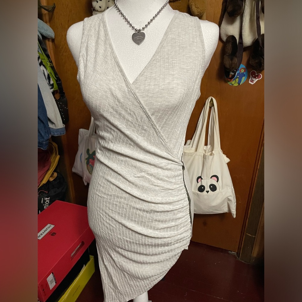 Asymmetrical grey tank dress with side zipper.